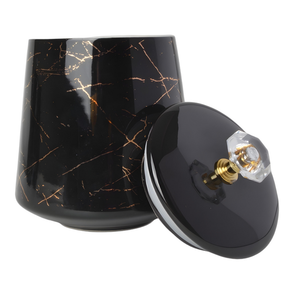 Set of three black ceramic canisters with gold marble design, each labelled for different contents: coffee, sugar, and tea. PALM GIFTS