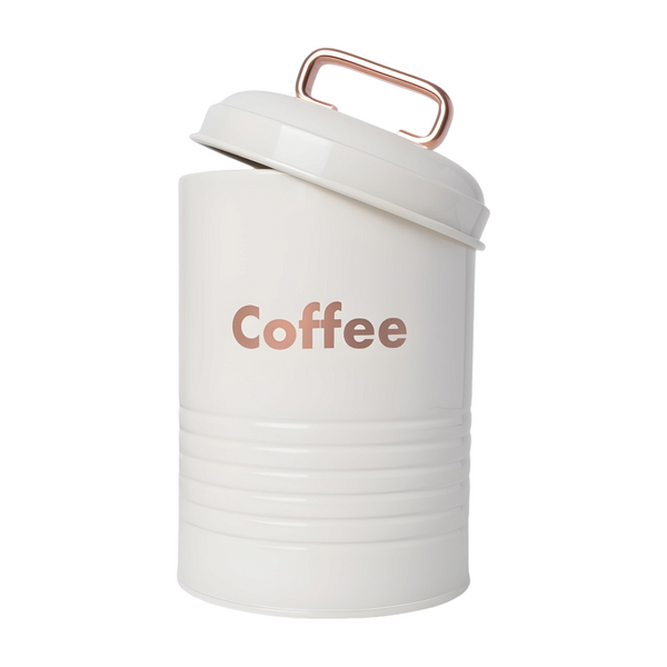 Three white kitchen canisters with rose gold lids, each labelled with a different word: coffee, sugar, and tea.PALM GIFTS