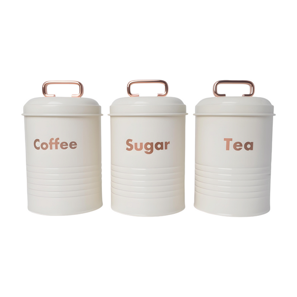 Three white kitchen canisters with rose gold lids, each labelled with a different word: coffee, sugar, and tea. PALM GIFTS