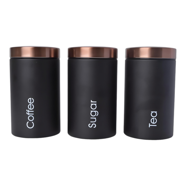 Set of three black metal kitchen canisters with rose gold lids, labelled sugar, tea, and coffee. PALM GIFTS