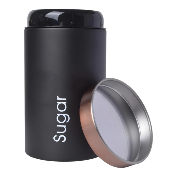 Set of three black metal kitchen canisters with rose gold lids, labelled sugar, tea, and coffee. PALM GIFTS
