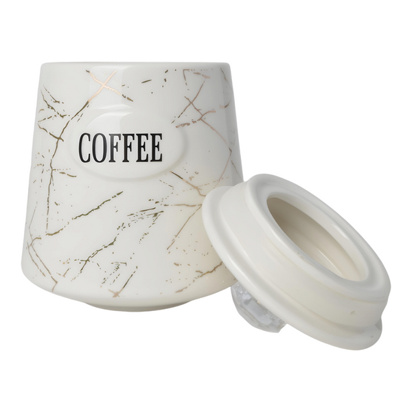 Three white ceramic kitchen canisters with gold marble design and gold handles, each labelled with different contents: coffee, sugar, and tea.