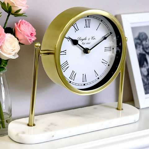 Gold Round Mantel Clock On White Marble Base