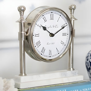 Silver Round Column Mantel Clock On White Marble Base