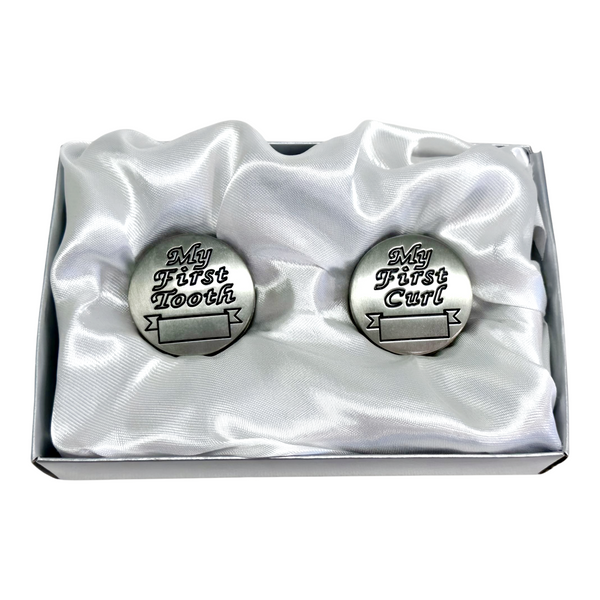Set of two silver pewter baby keepsakes for first tooth and first curl, presented in a satin gift box. Palm Gifts