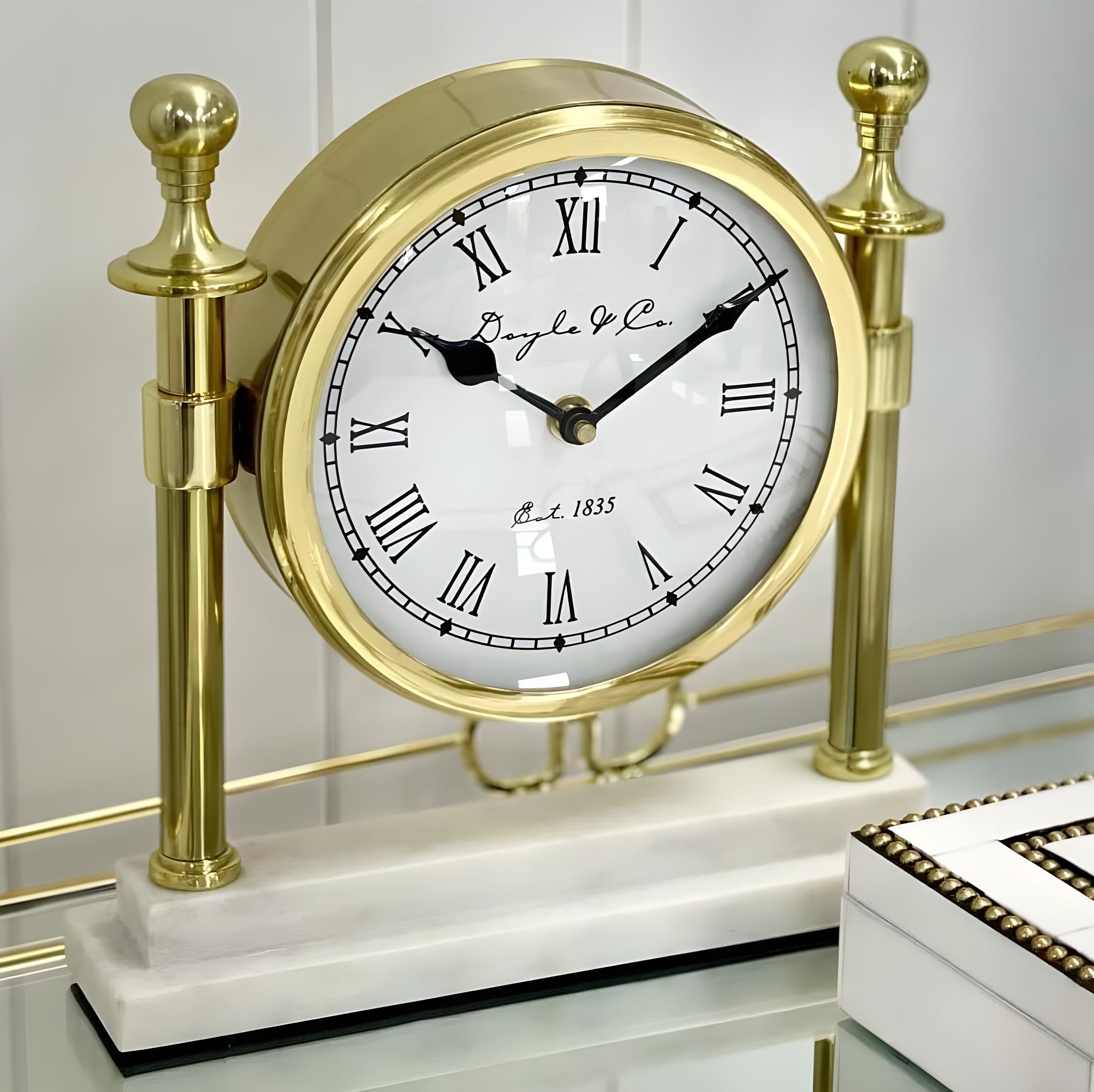 Gold Round Column Mantel Clock On White Marble Base