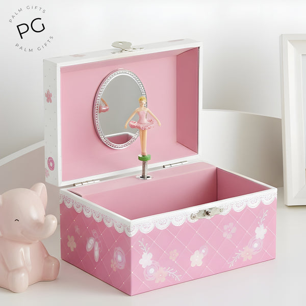 children's pink musical jewellery box with a ballerina figure inside, featuring a mirror and a floral pattern.